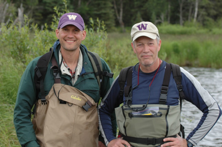 Aaron Wirsing and Tom Quinn standing in a stream in waders