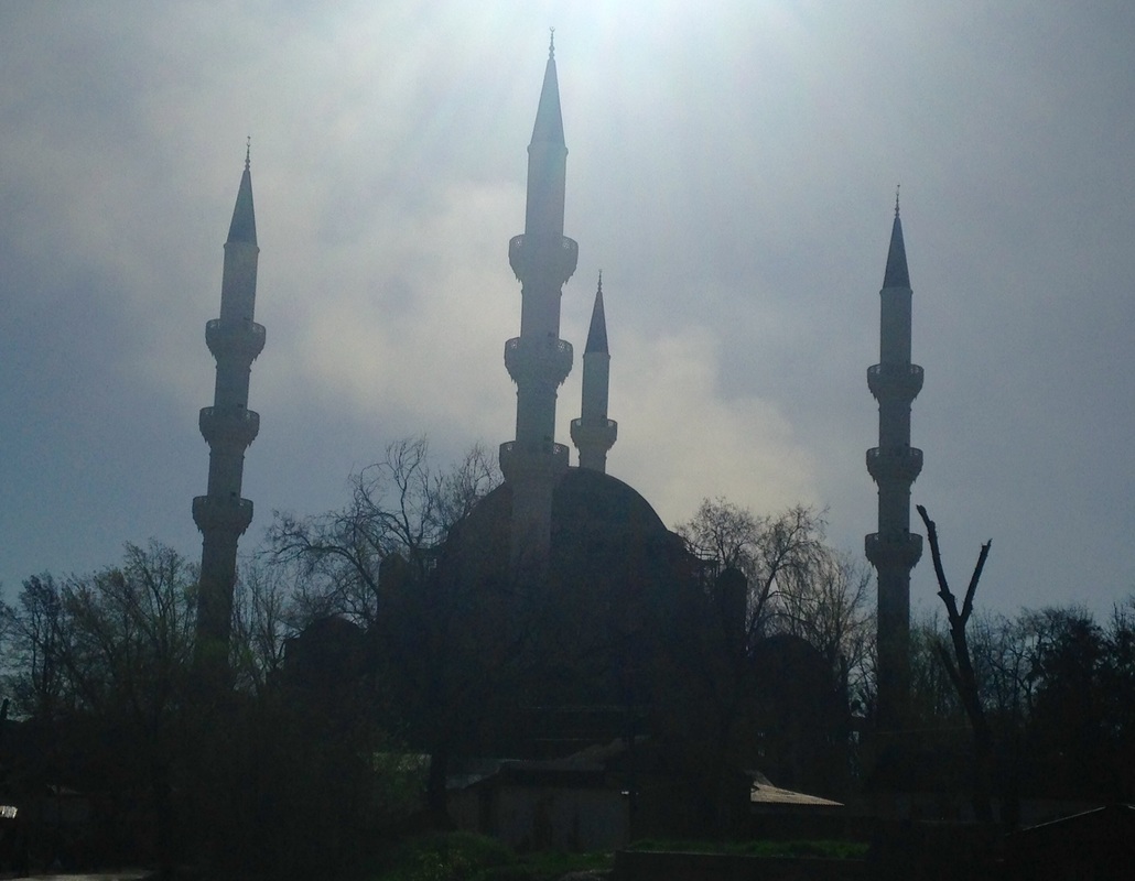 Tall minarets rising above a mosque