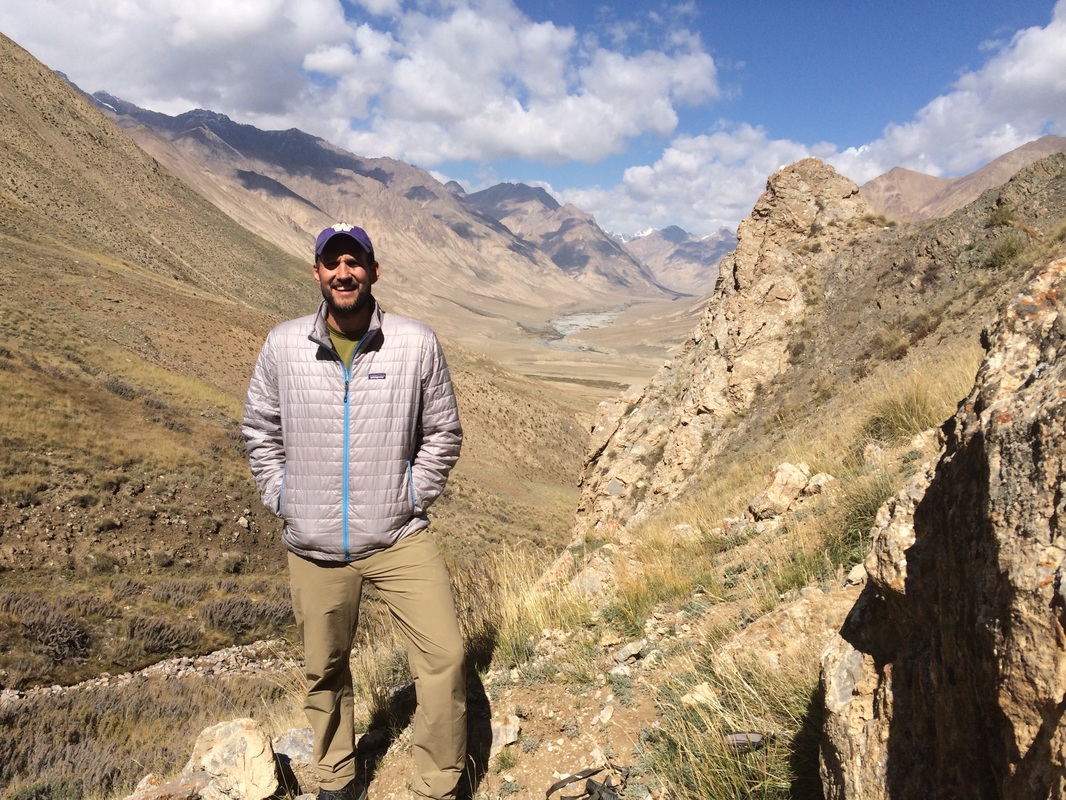 Aaron Wirsing standing in Tian Chan Mountains